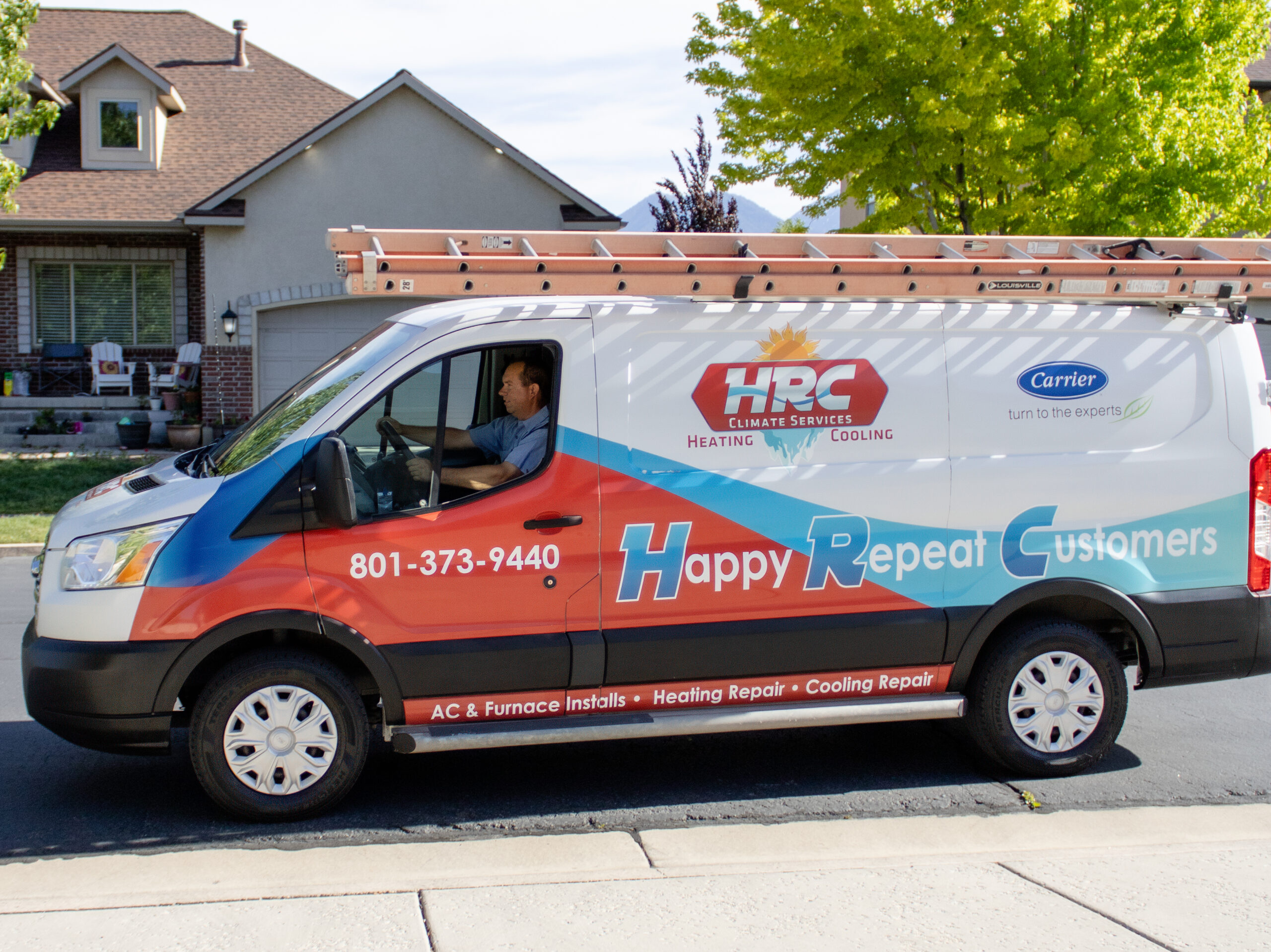 HRC Climate Services Heating and Cooling work van with HVAC technician in Spanish Fork Utah. 